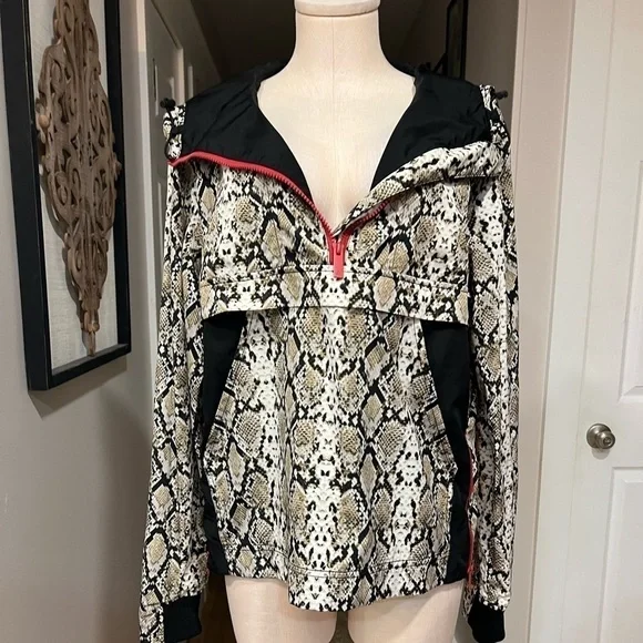 ALALA snakeskin anorak with red accents